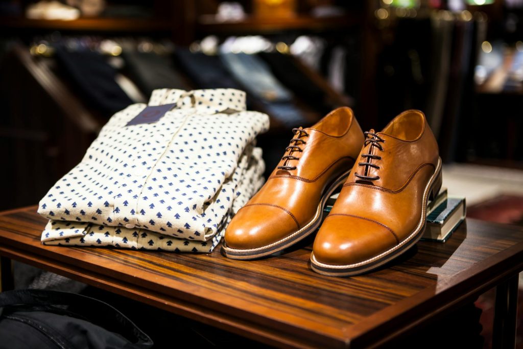 Mens shirt and shoes on a display table